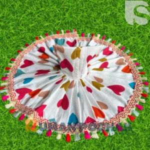 “Kanha Ji wearing Prem Patra poshak – colorful cotton dress with heart motifs and tassel lace from SumanPoshak”