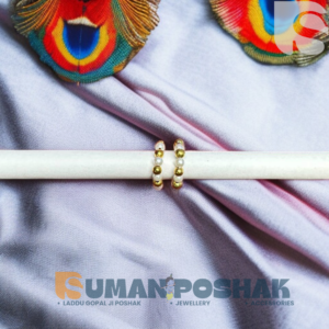 Golden bangle for Laddu Gopal Ji with peacock feather and silk background