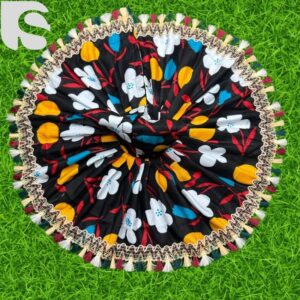 Black cotton Laddu Gopal dress with white, yellow, and blue floral print and colorful lace border.
